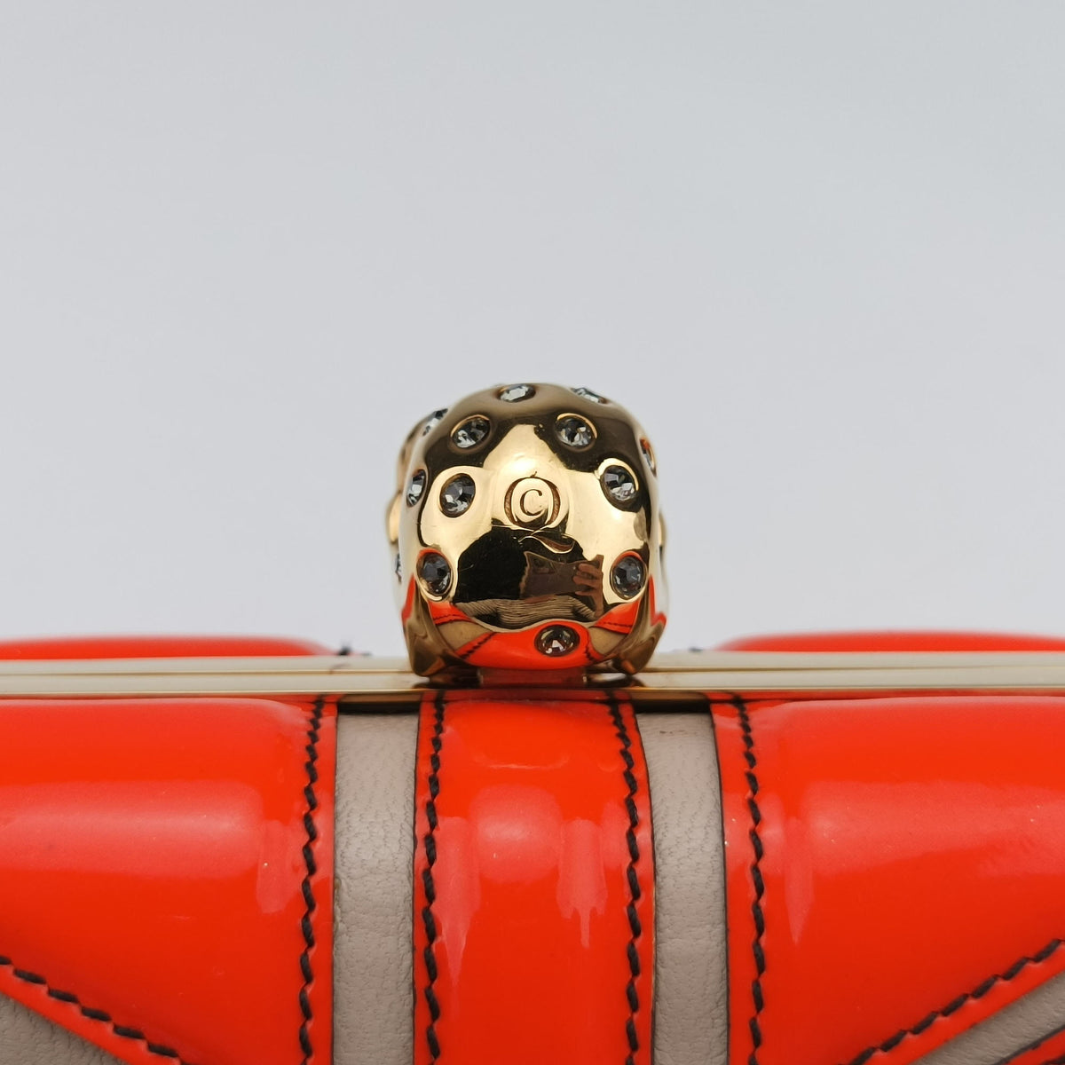 Secondhand Alexander McQueen skull clutch Orange Enamel x Leather  clutchbag | stylenewstar