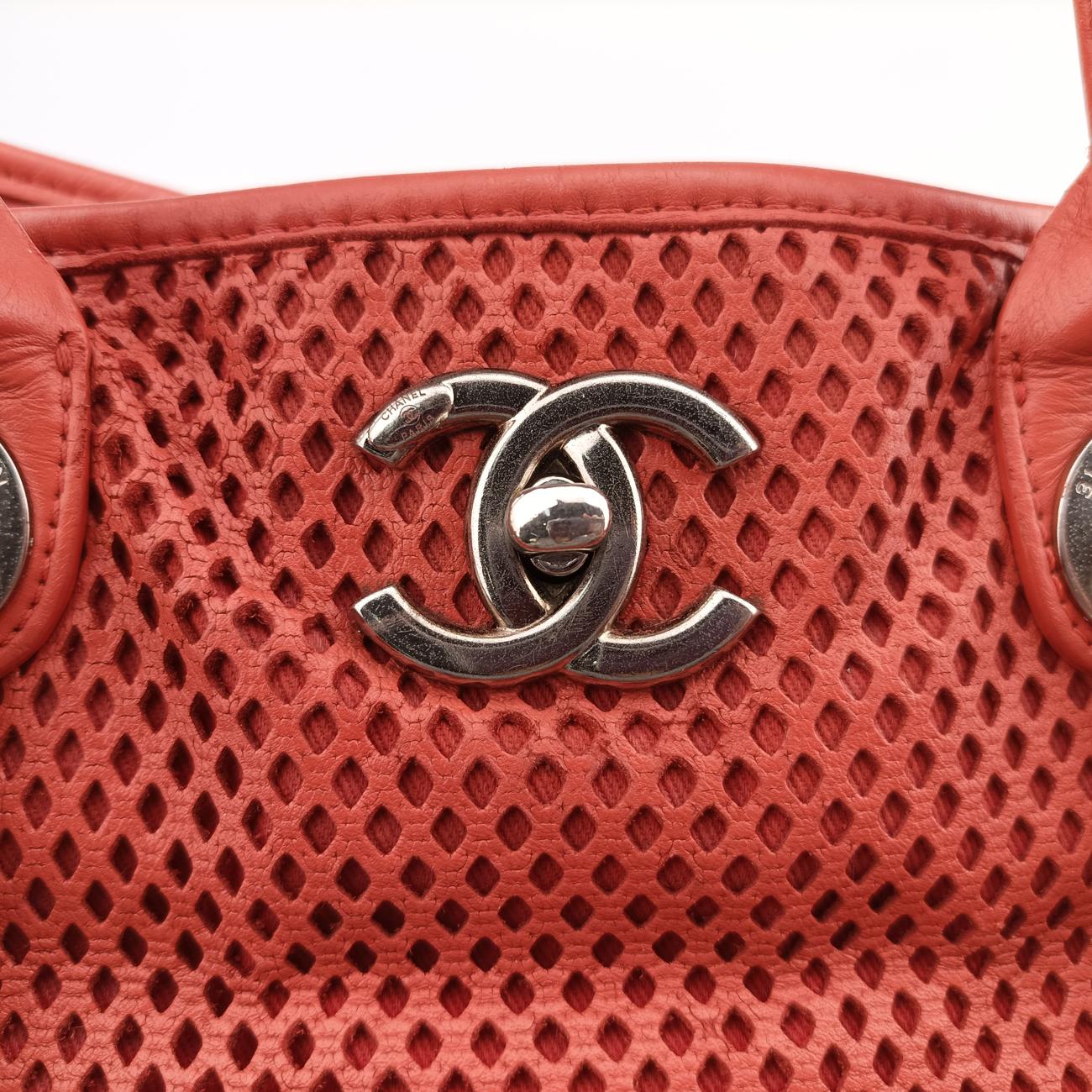 Vintage Chanel Up in the Air Perforated French Riviera Orange Leather A67654 shoulderbag | stylenewstar