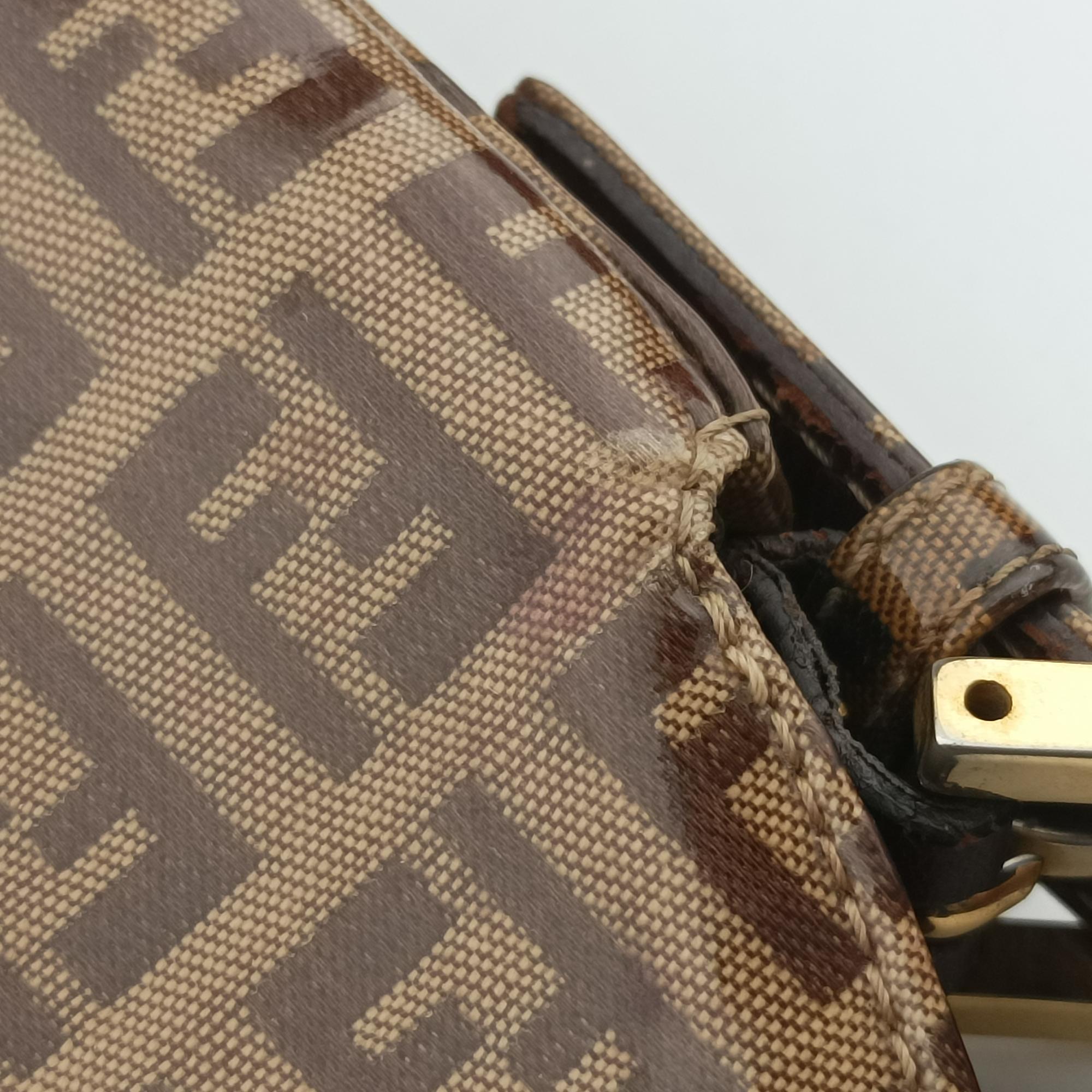 Vintage Fendi Mamma Baguette Brown PVC coated canvas 26725 handbag | stylenewstar