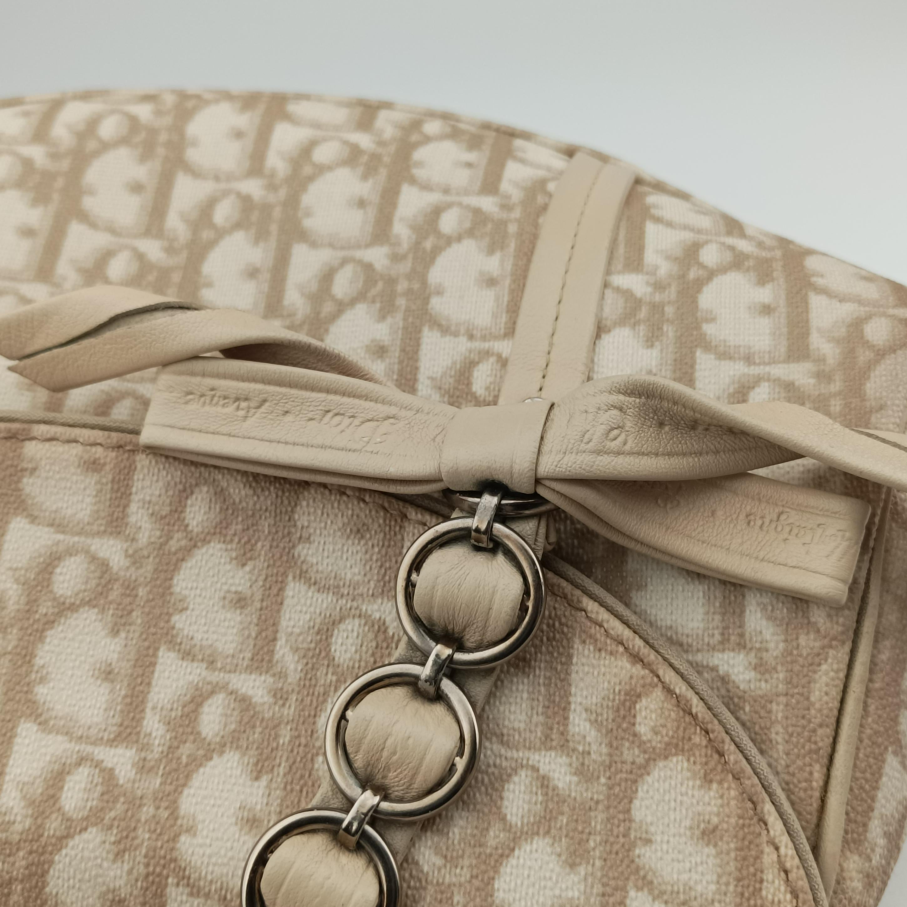 Pre-owned Christian Dior Romantique Trotter Beigex White PVC coated canvas  handbag | stylenewstar