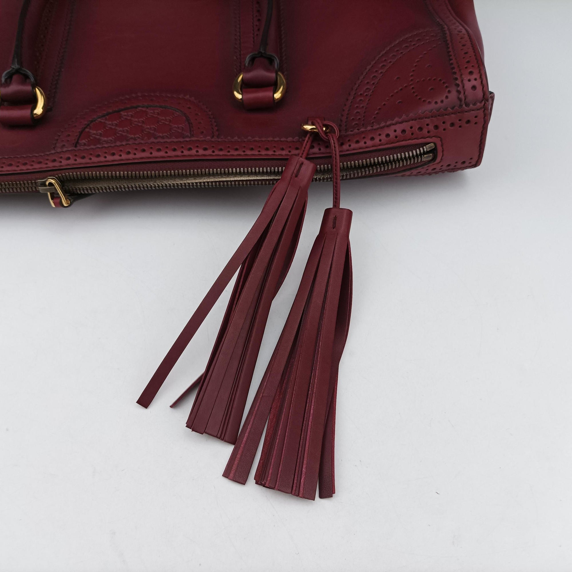 Pre-owned Gucci Duilio Brogue Burgundy Leather 296903 handbag | stylenewstar