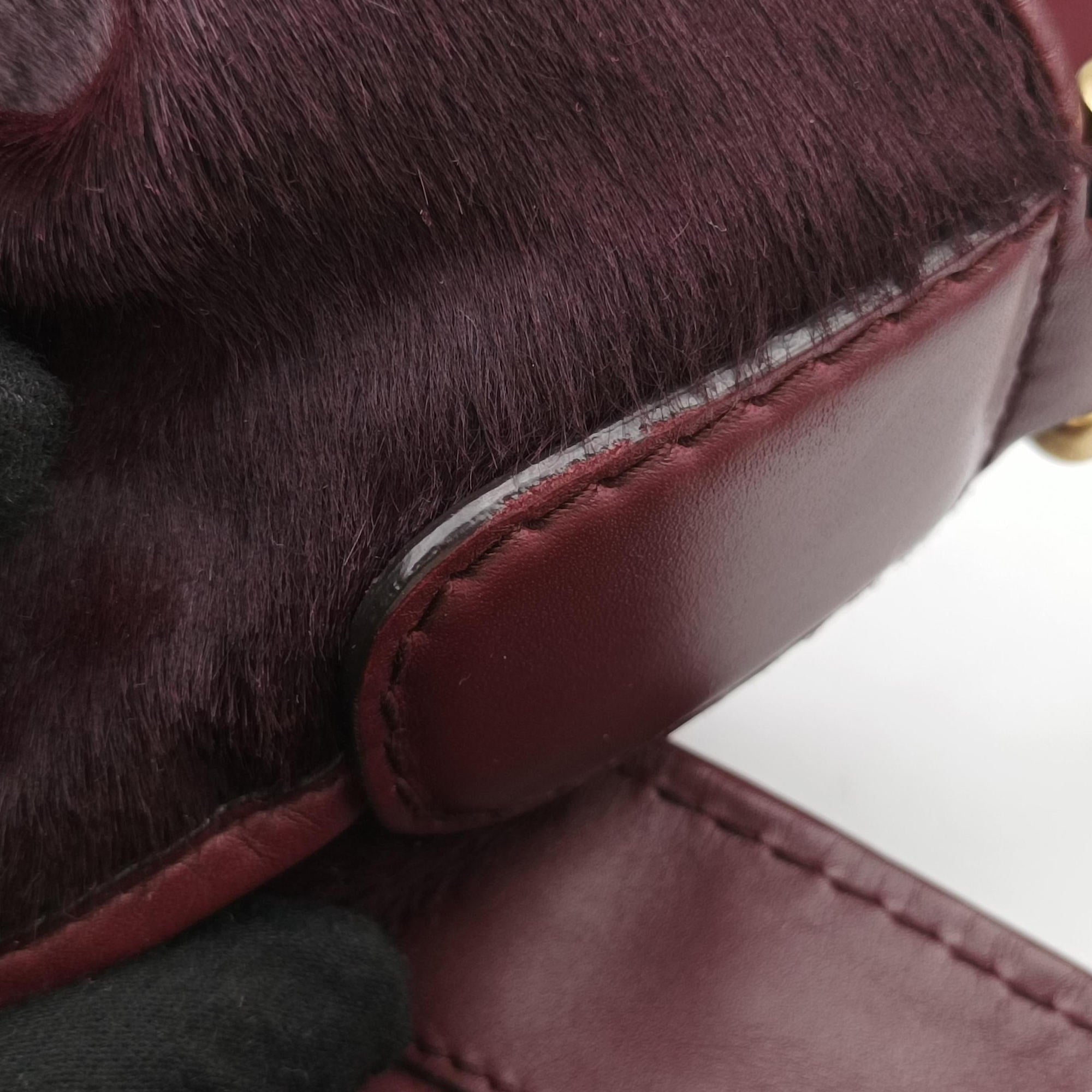 Secondhand Gucci Stirrup Exotic Horsebit Burgundy ponyhair 296855 handbag | stylenewstar