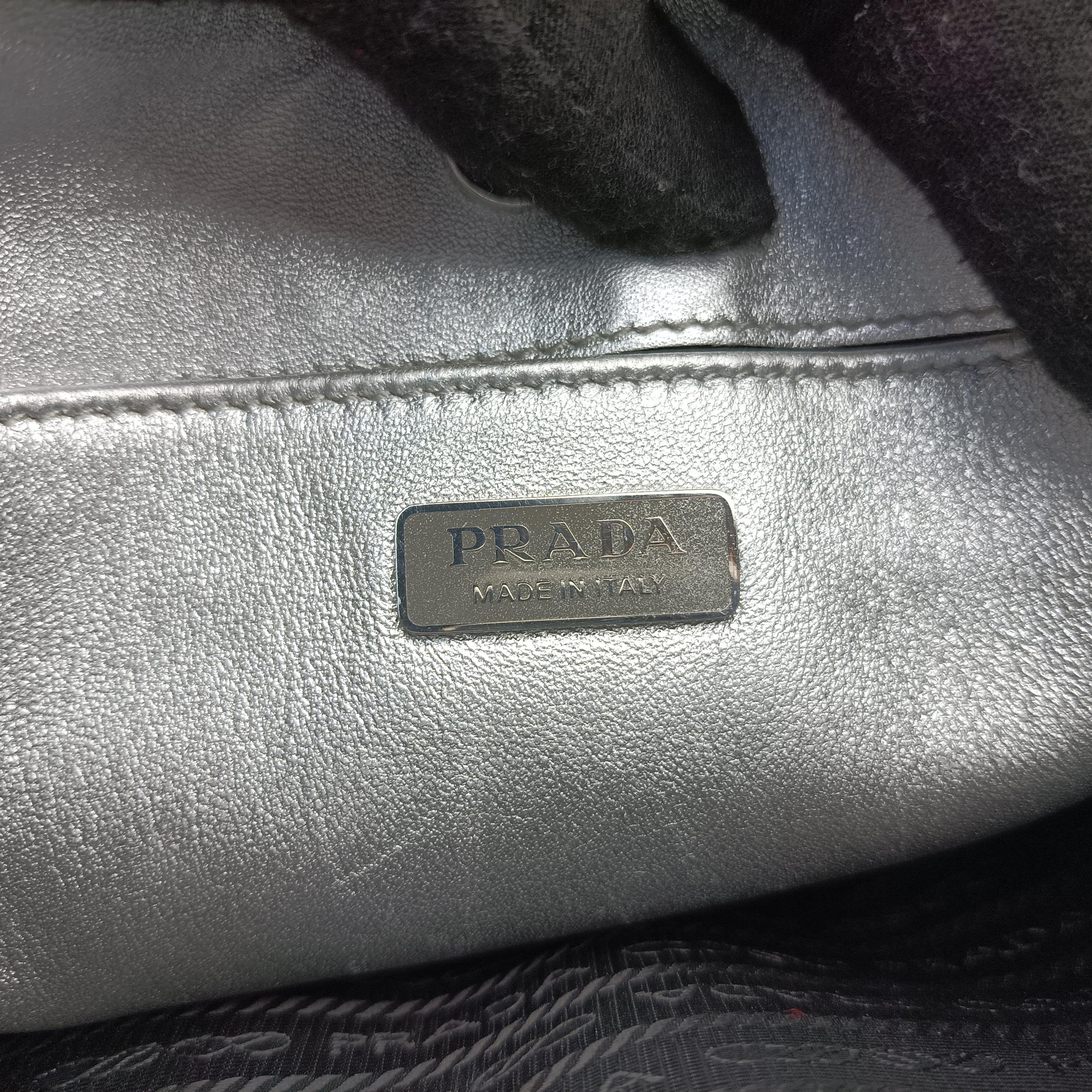 Pre-owned Prada Cleo Silver Enamel 1BC499 handbag | stylenewstar