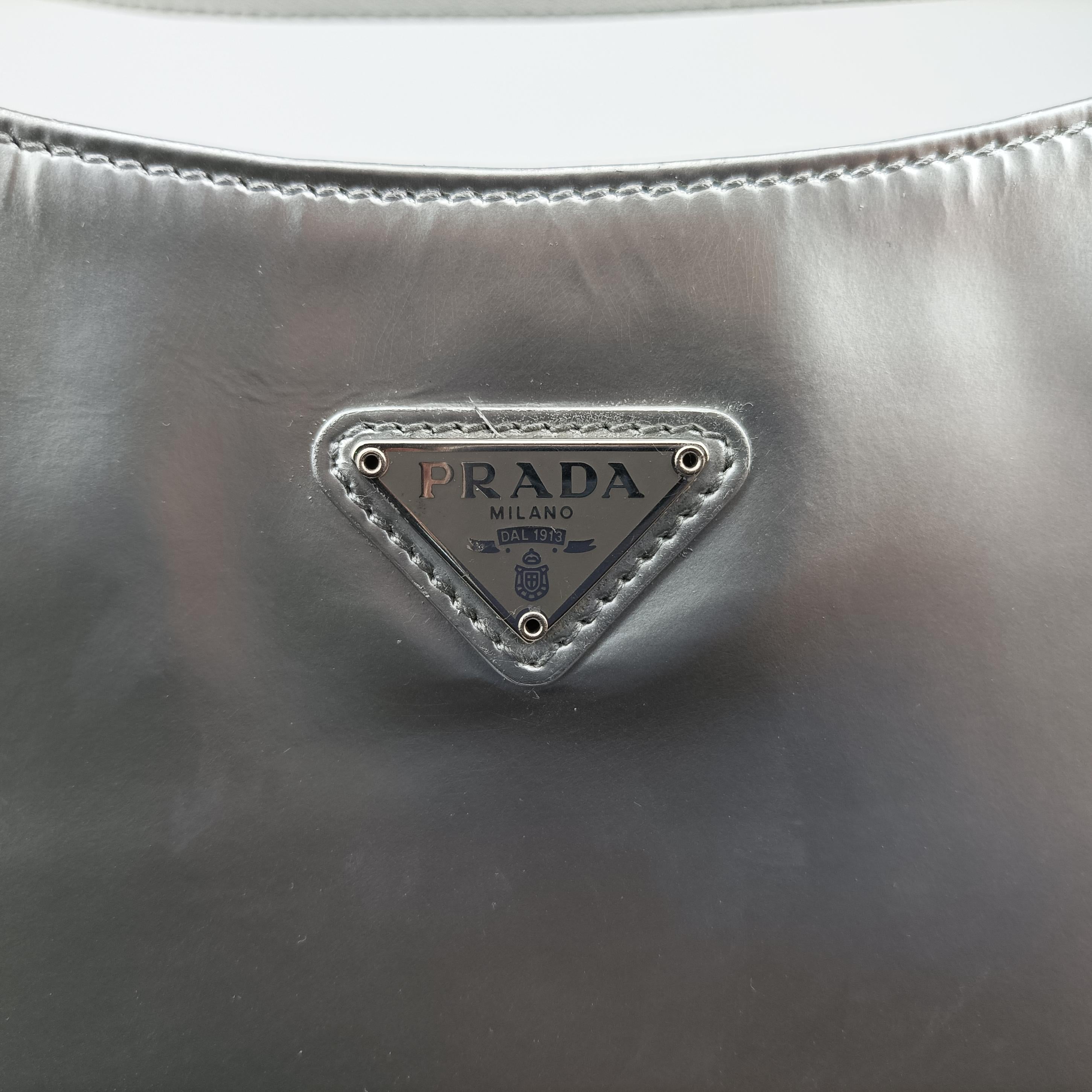 Pre-owned Prada Cleo Silver Enamel 1BC499 handbag | stylenewstar
