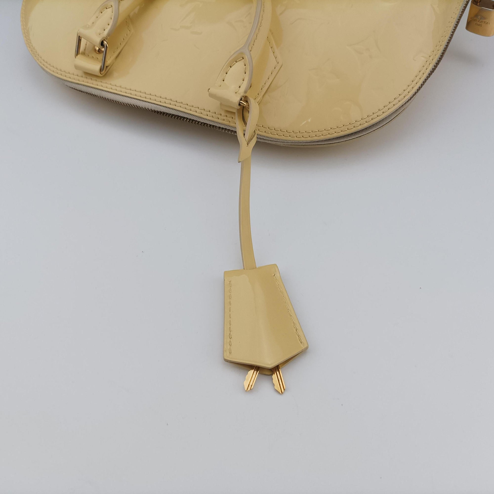 Secondhand Louis Vuitton ALMA PM CITRINE Vernis M90101 handbag | stylenewstar
