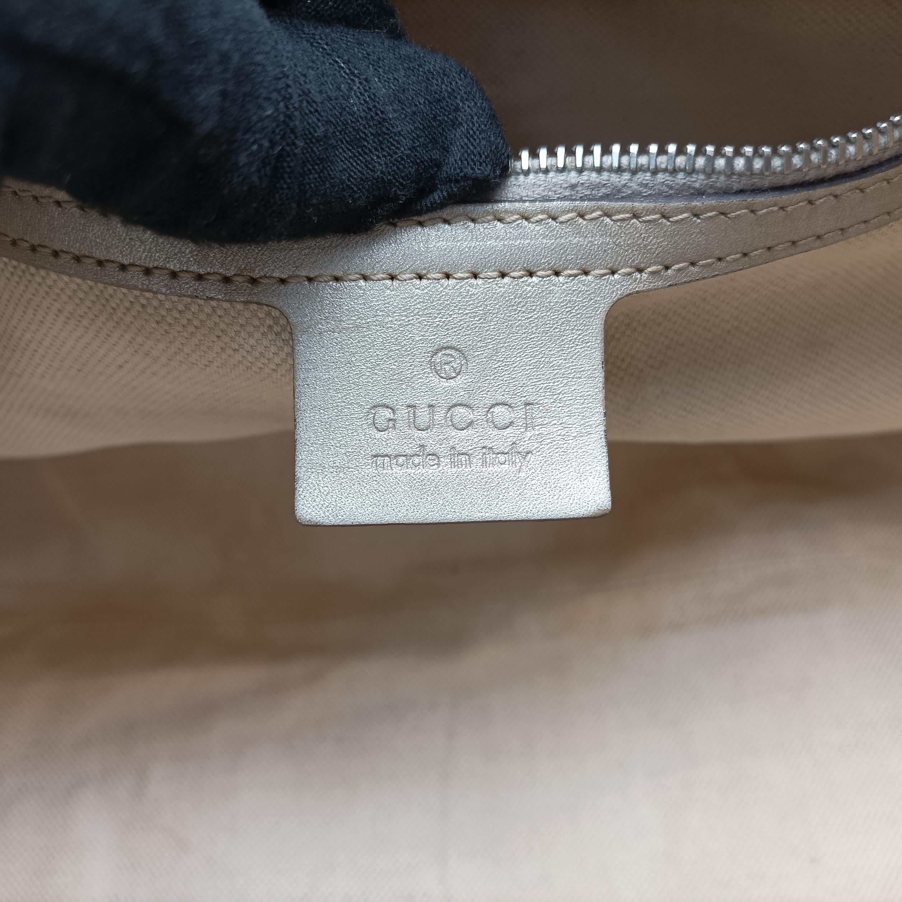 Secondhand Gucci Jackie Silver PVC coated canvas 203494 handbag | stylenewstar