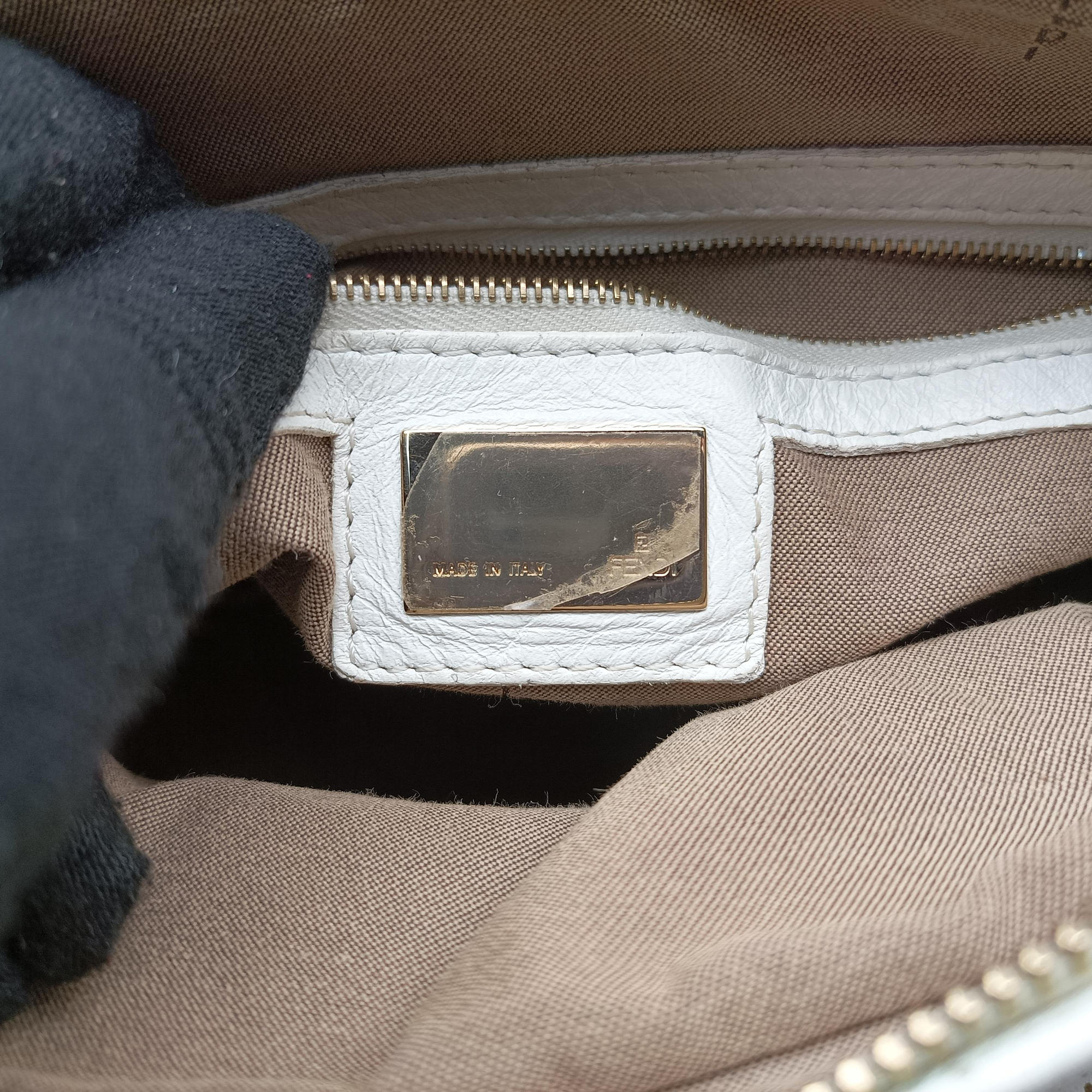 Secondhand Fendi Chef Perforated Charm Zucca Print White Leather 8BR448 handbag | stylenewstar
