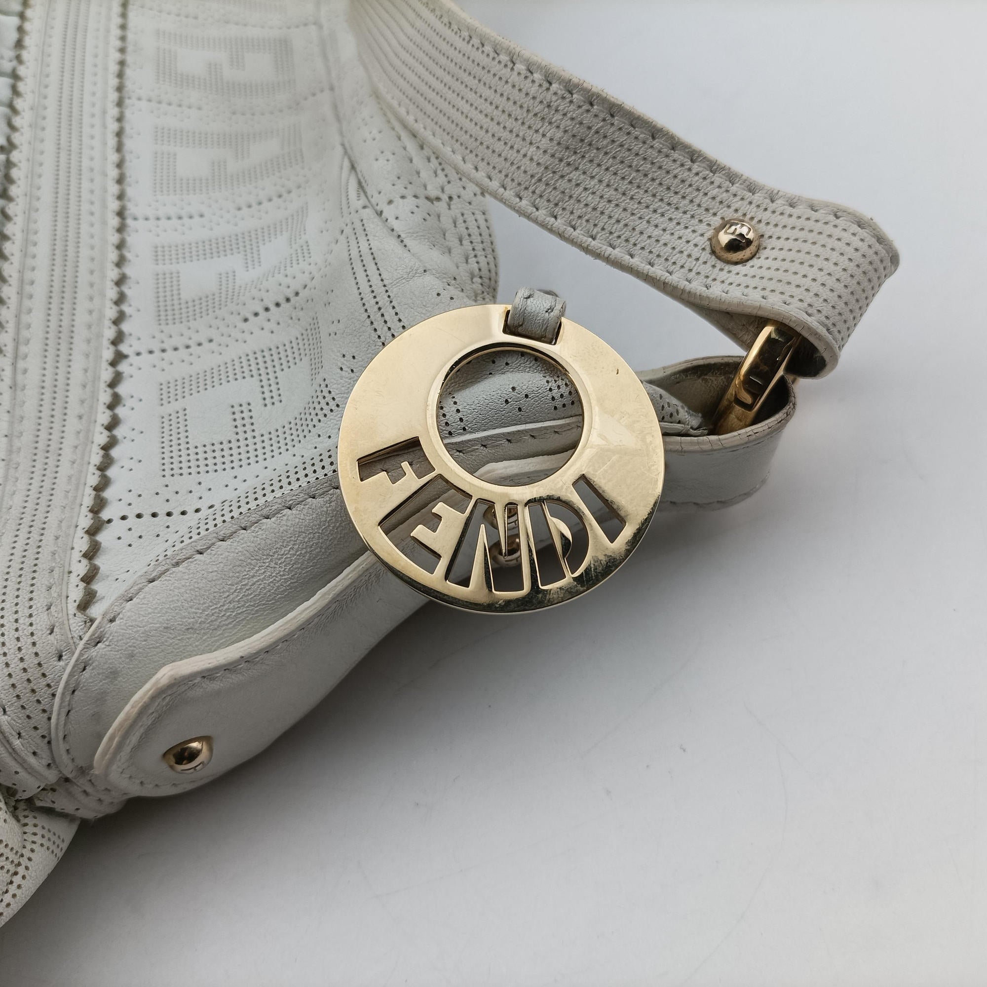 Secondhand Fendi Chef Perforated Charm Zucca Print White Leather 8BR448 handbag | stylenewstar