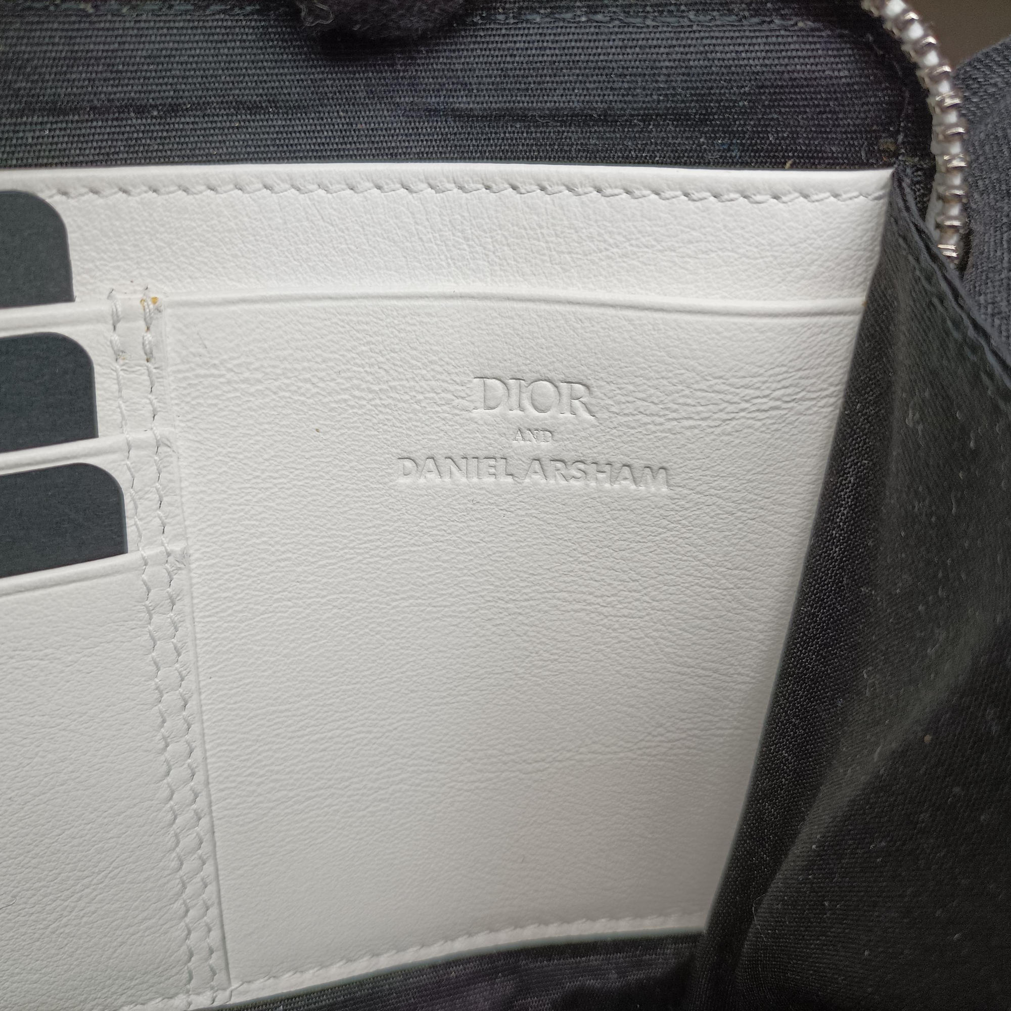 Secondhand Christian Dior Daniel Arsham collaboration Newspaper Print White Leather  shoulderbag | stylenewstar