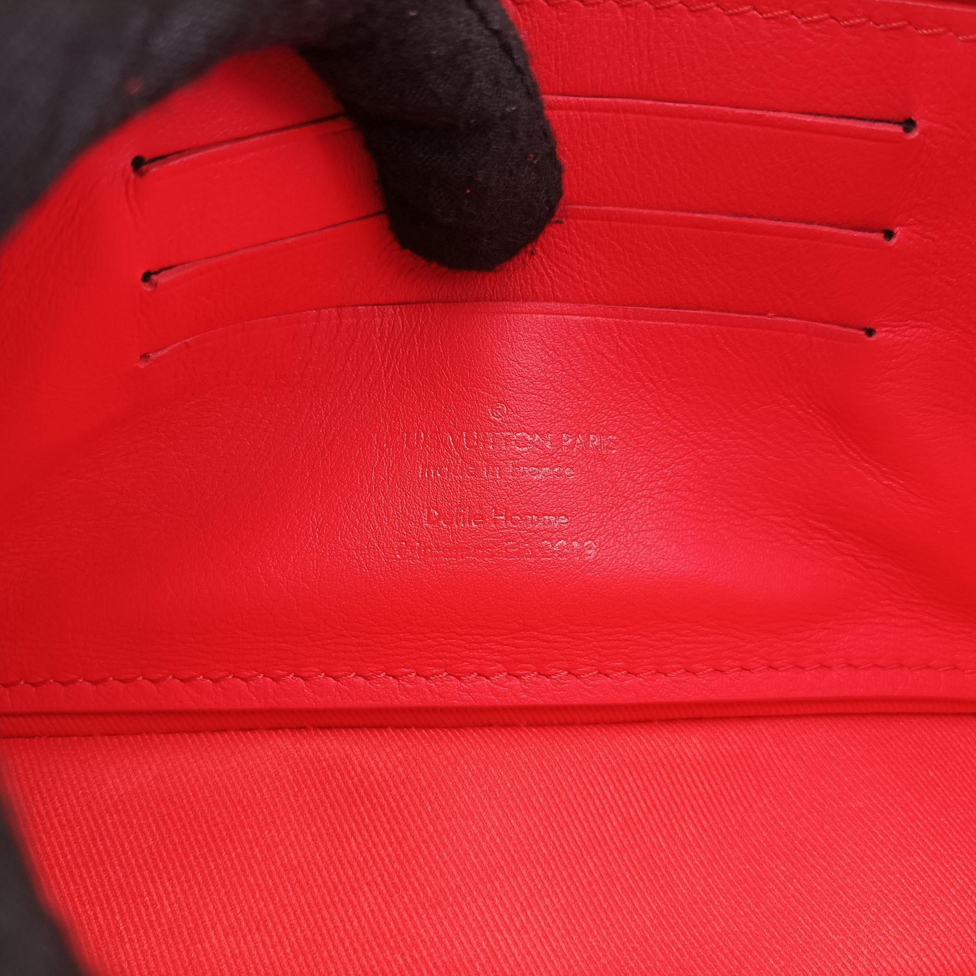 Vintage Louis Vuitton Pochette Volga Red Monogram Empreinte M53555 clutchbag | stylenewstar