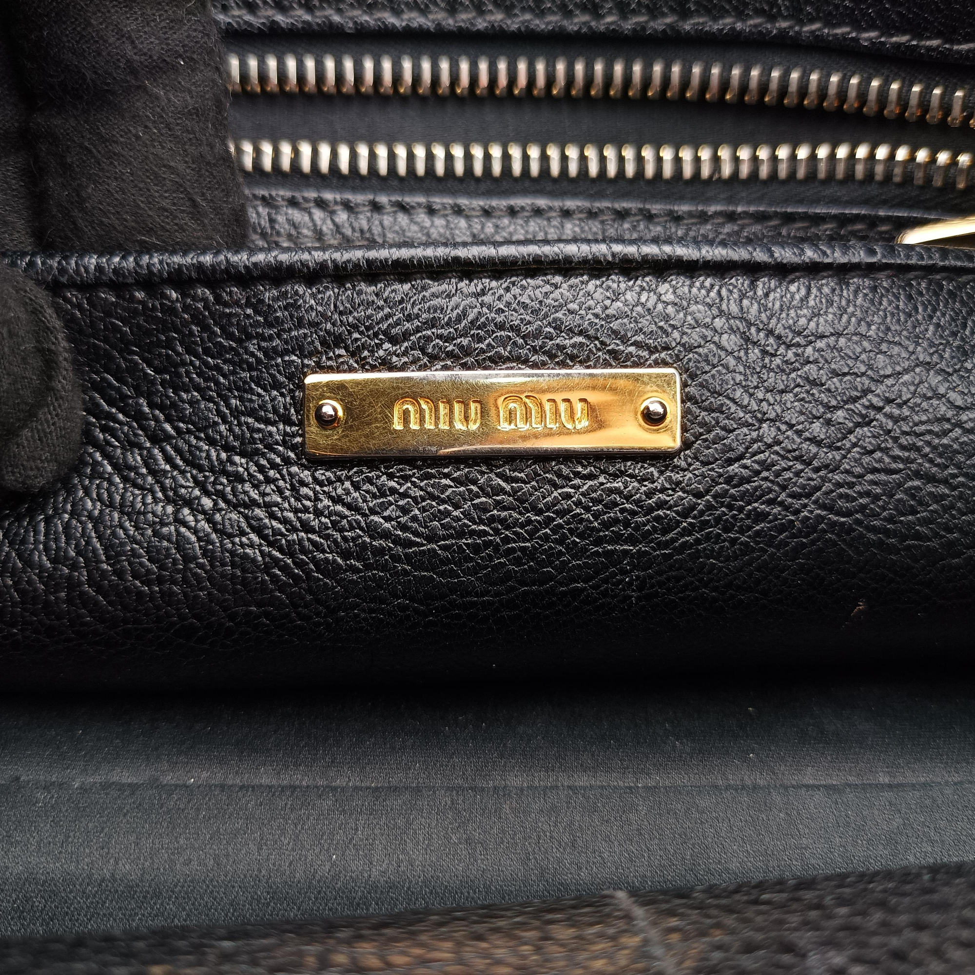 Vintage Miu Miu Madras Black Leather RN1016 handbag | stylenewstar