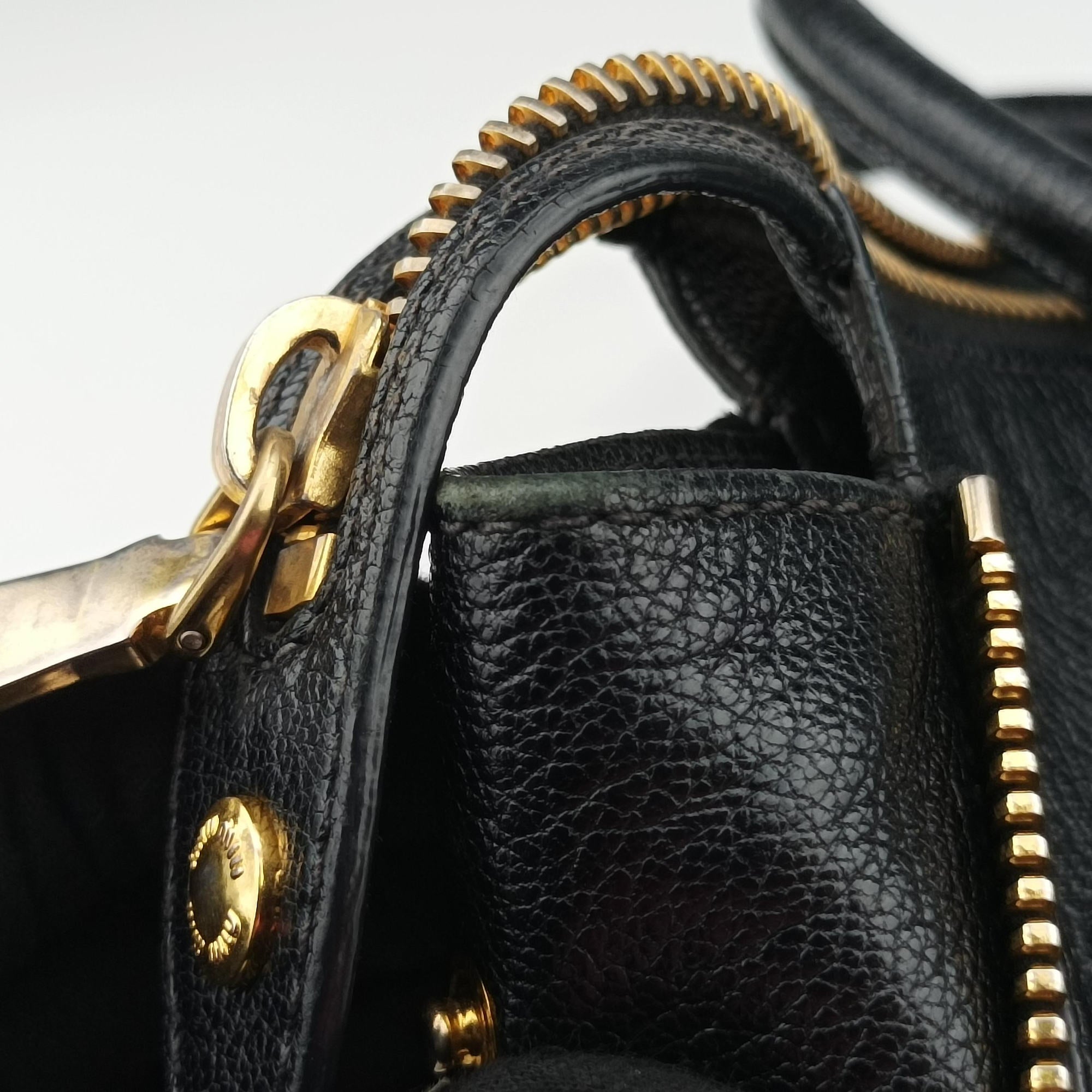 Vintage Miu Miu Madras Black Leather RN1016 handbag | stylenewstar
