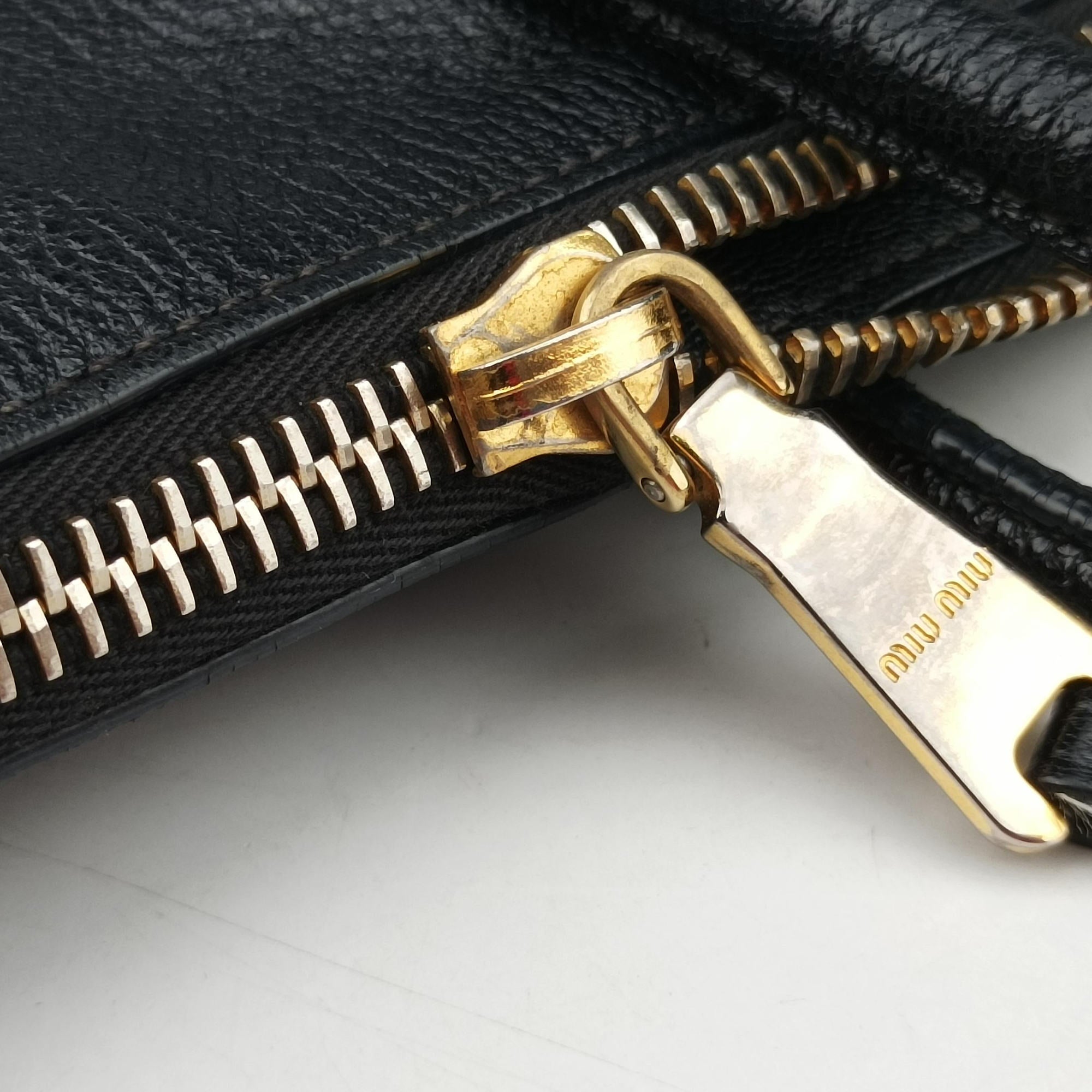 Vintage Miu Miu Madras Black Leather RN1016 handbag | stylenewstar